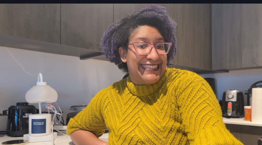 Kristen sitting in the kitchen part of her DC living kitchen